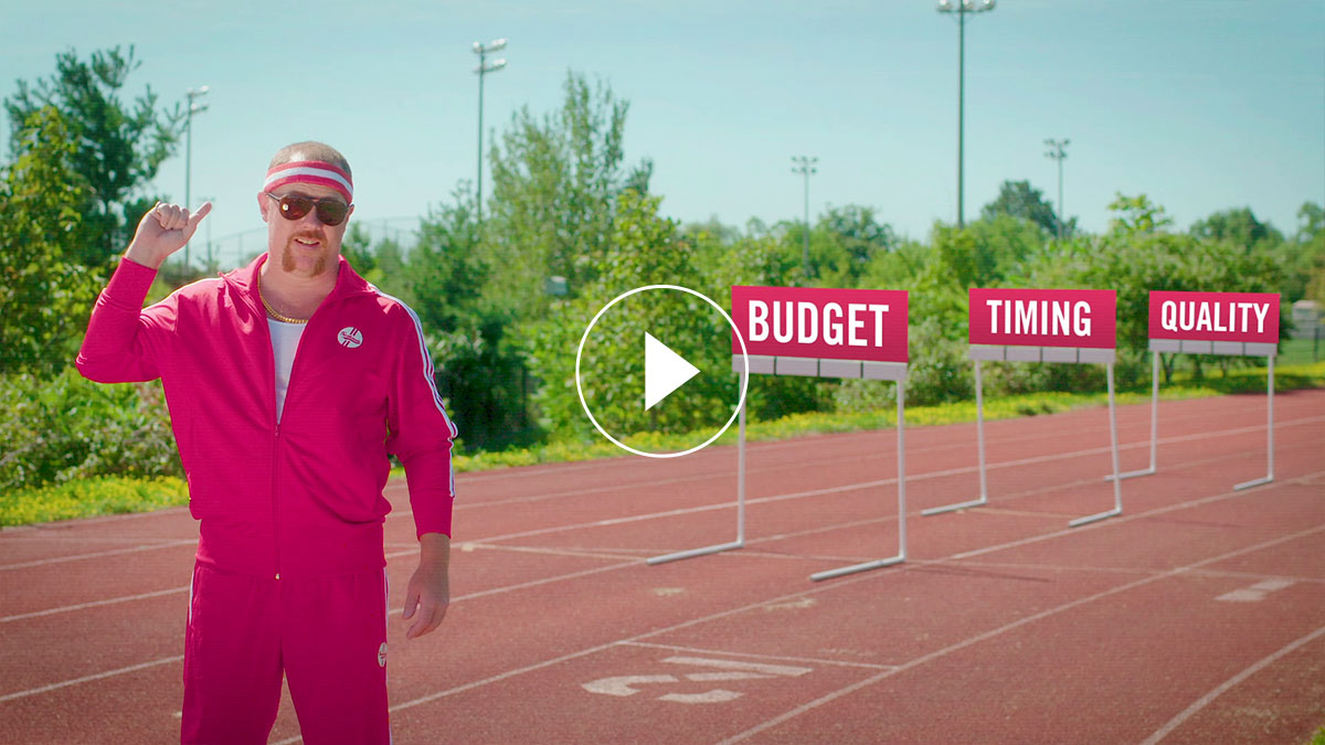 A man in a pink track suit in a running track field